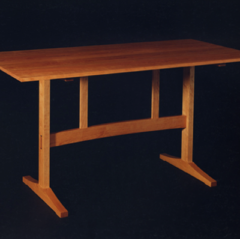 A kitchen table in Cherry.